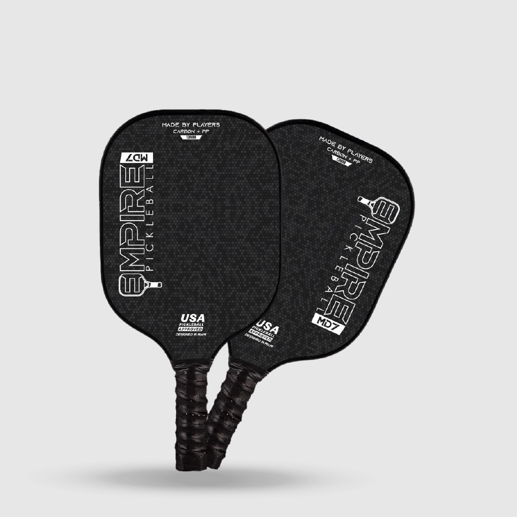 Two black carbon fiber Empire Pickleball paddles with USA Pickleball approval, designed for competitive players.