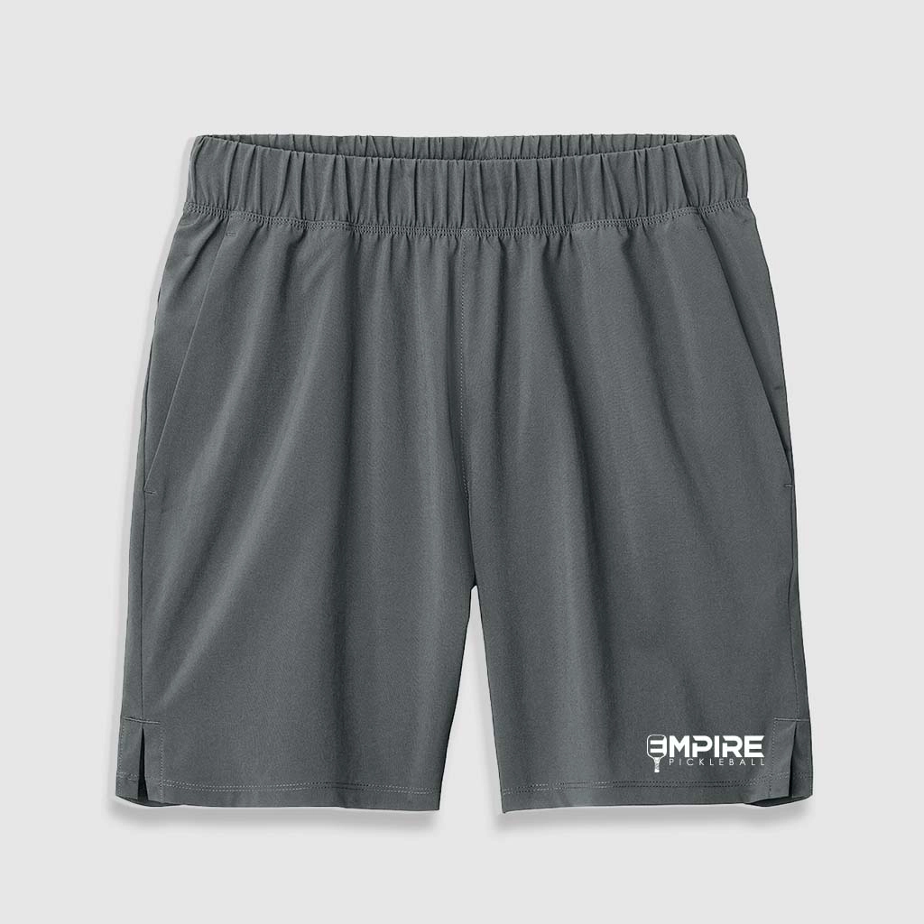 Dark gray Empire Pickleball men’s shorts featuring a relaxed fit, side pockets, and logo on the hem.