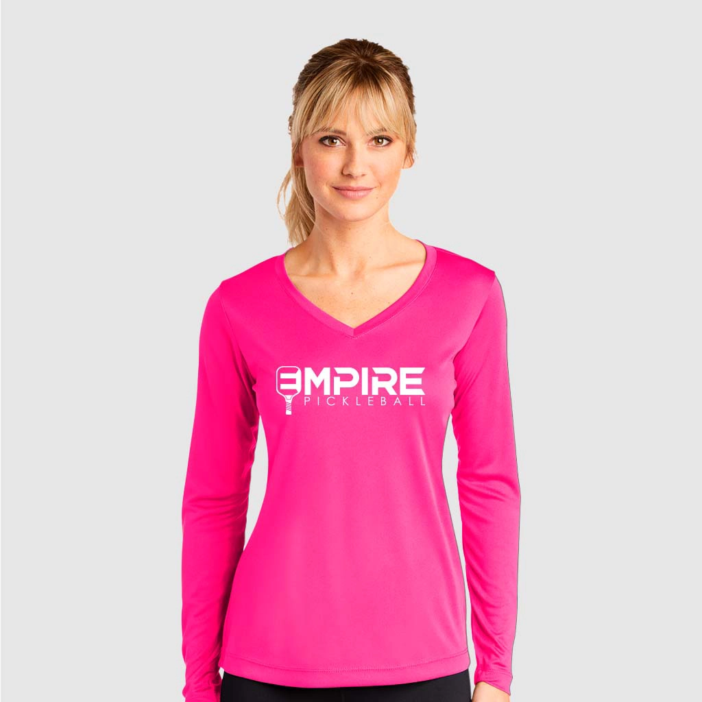 Pink long sleeve Empire Pickleball Dri Fit women’s shirt with v-neck and white logo.